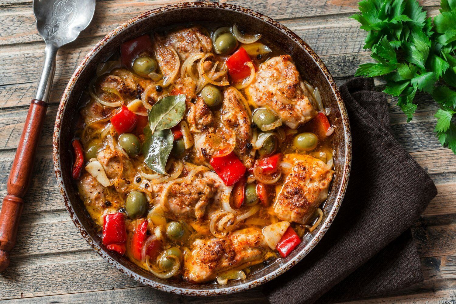 Slow Cooker Mediterranean Chicken Slow Cooker Mediterranean Chicken with roasted red peppers, olives, capers, and more in a skillet.